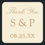 Cream Beige Wedge Favor Gracias Pegatina<br><div class="desc">Cream Beige Wedding Favor Gracias Pegatina,  por favor personaliza con las iniciales de la pareja y la fecha del boda,  usando la plantilla de personalización en línea antes de pedir. Un pegatina agradable con textos de diseño en un tono beige dorado sobre un fondo crema.</div>