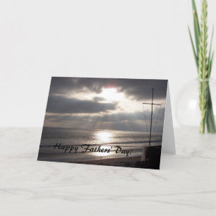 Cruz en la tarjeta del día de padres de la playa
