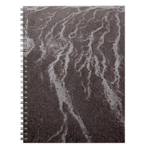 Cuaderno Agua en la arena en la orilla