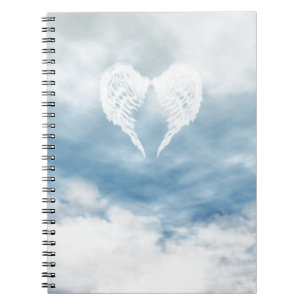 Cuaderno Alas del ángel en cielo azul nublado