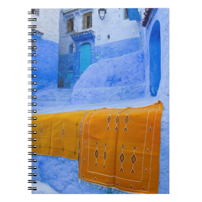 Cuaderno Alfombras Colgadas En Una Pared Azul (Frente)