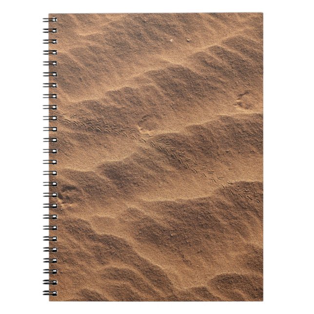 Cuaderno Arena marrón con agua durante el día (Frente)