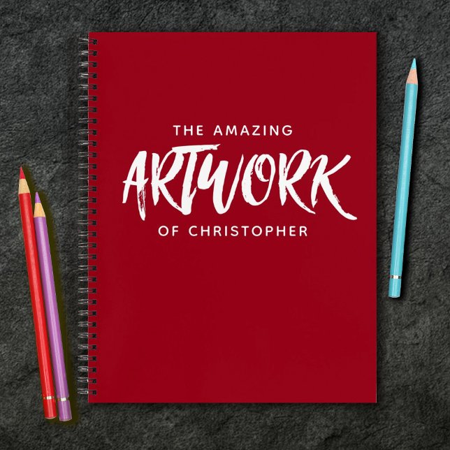 Cuaderno Bloc de notas rojo con guión de pincel personaliza (A cool red sketchbook with the words, The amazing artwork of.... Personalize it with your name.)