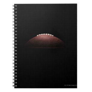 Cuaderno Bola del fútbol americano en fondo negro