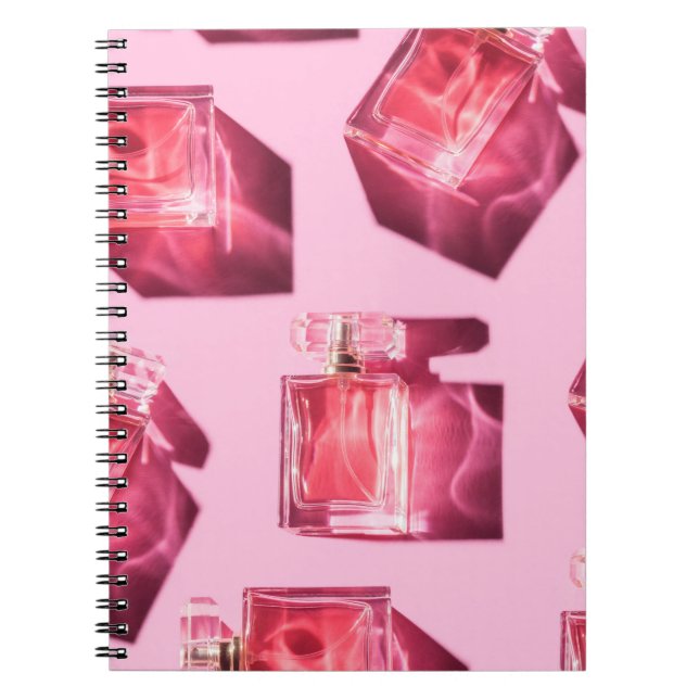 Cuaderno Botellas perfumes, fondo rosado, liofilizado (Frente)