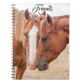 Cuaderno Caballos zumbando en un pasto