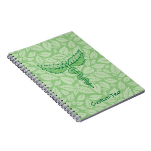 Cuaderno Caduceo con bloc de notas de fondo de hojas