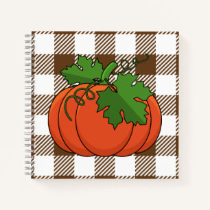 Cuaderno Calabaza naranja sobre el patrón de cuadros de col