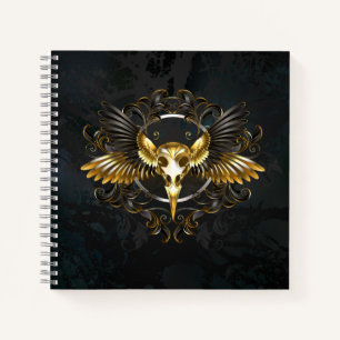 Cuaderno Calavera de pájaro dorado sobre fondo negro