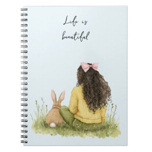 Cuaderno Chica de pelo negro con conejo de lazo rosa y hier