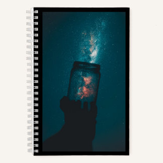Cuaderno Ciencia del Cosmos en un bloc de notas en una espi
