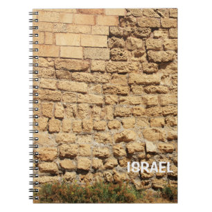 Cuaderno con muro de piedra en Israel