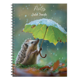 Cuaderno Corte erizo sosteniendo un paraguas de hoja