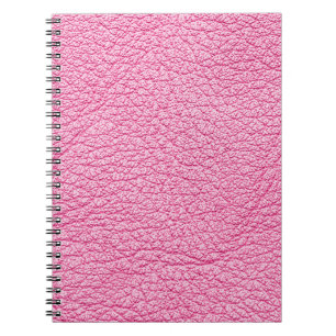 Cuaderno Cuero rosa de cierre, fondo texturado.