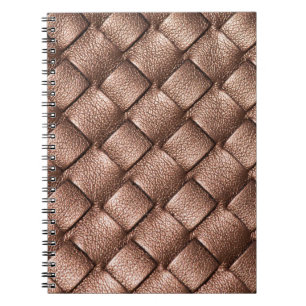 Cuaderno Cuero trenzado, fondo de color bronce.