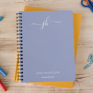 Cuaderno de bocetos con monograma azul y nombre