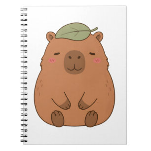 Cuaderno de capibara lindo con hoja verde en la ca