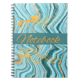 cuaderno de color aqua y dorado