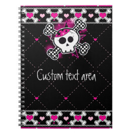 Cuaderno de cráneos rosados con huesos cruzados y 