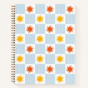 Cuaderno de cuadros rayados con explosión de sol e