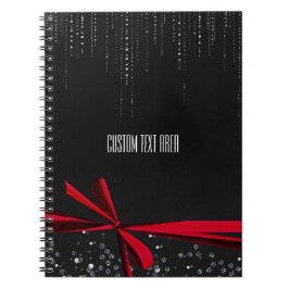 Cuaderno de diario con lazo rojo brillante y cinta