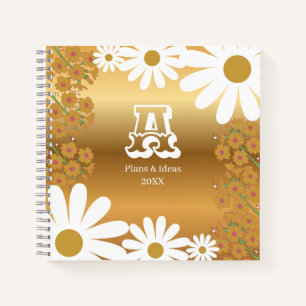 Cuaderno de margarita dorada floral con letra A