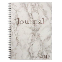 Cuaderno de mármol blanco de la fecha del diario