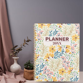 Cuaderno de planeamiento y diario amarillo con flo