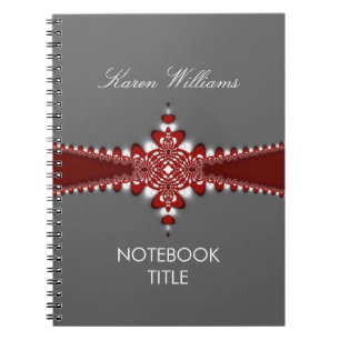 Cuaderno de plata con cinta roja regia