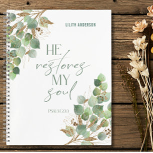 Cuaderno de versículos bíblicos con hojas doradas