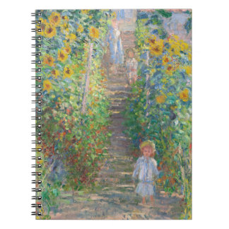 Cuaderno del camino del jardín iluminado por el so