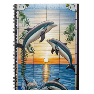 Cuaderno Delfines saltando al atardecer en el océano