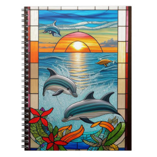 Cuaderno Delfines saltando al atardecer en el océano