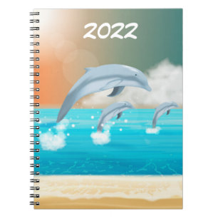 Cuaderno delfines saltando en el océano