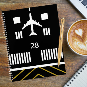 Cuaderno Despegue de avión en la pista de aterrizaje del ae