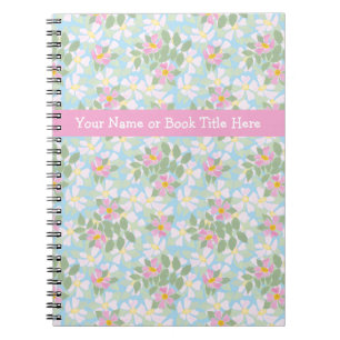 Cuaderno Dogroses rosados en un portátil de espiral azul ci