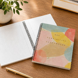 Cuaderno en espiral de formas abstractas con cita