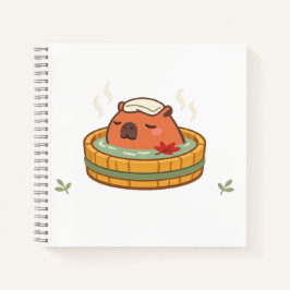 Cuaderno encantador de capybara en onsen