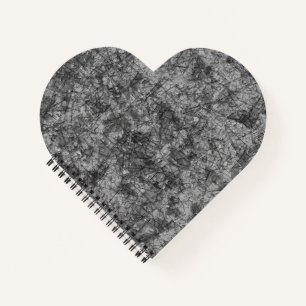 Cuaderno Escrates sobre un gris a negro ligeramente manchad