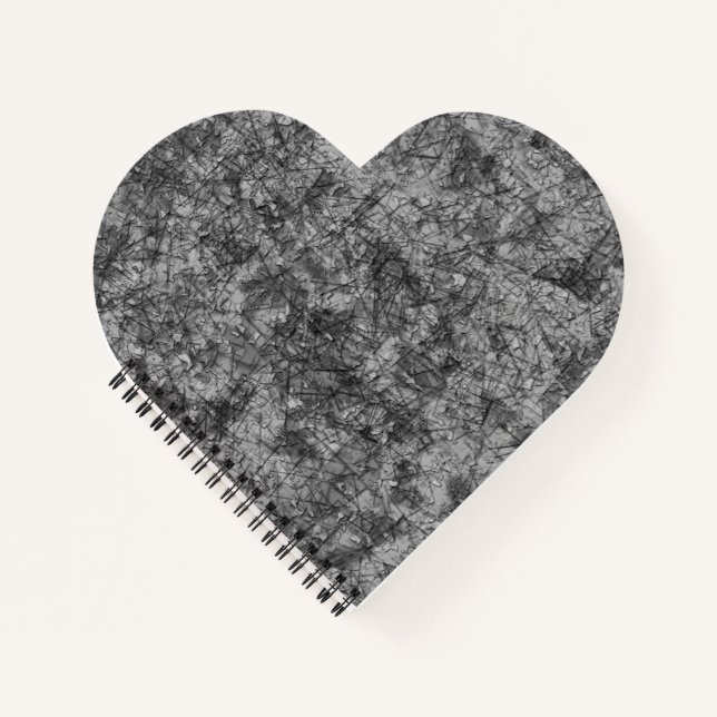 Cuaderno Escrates sobre un gris a negro ligeramente manchad (Anverso)