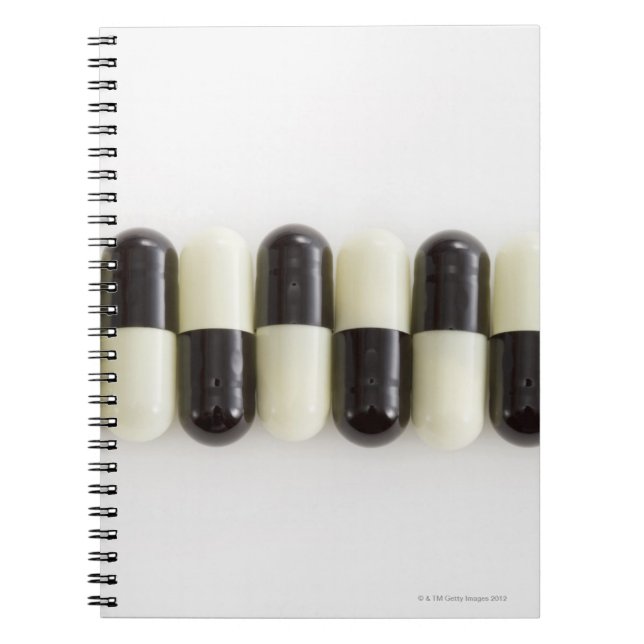 Cuaderno Fila de pastillas blancas y negras (Frente)