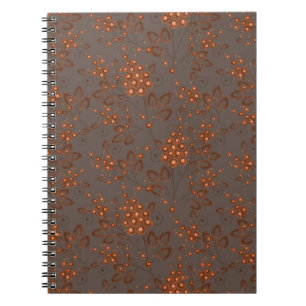 Cuaderno Flores naranjas sobre un fondo gris parduzco.