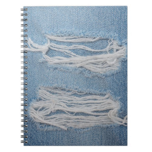 Cuaderno Fondo de textura de vaqueros de denim azul rotos. 