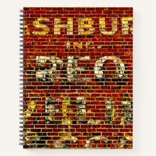 Cuaderno Foto de pintura de letrero desgastado en edificio 
