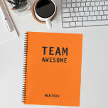 Cuaderno Funny Team Personalized Notes Office Meeting<br><div class="desc">Funny Team Personalized Notes Office Meeting Notebook incluye el texto "Team Awesome" con su nombre personalizado debajo en un fondo naranja. Personalice editando el texto en el cuadro de texto proporcionado. Diseñado por ©Evco Studio www.zazzle.com/store/evcostudio</div>