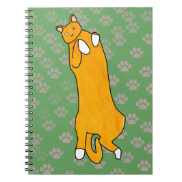 Cuaderno Gato naranja acostado sobre su espalda