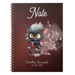 Cuaderno Gato negro juguetón en bicicleta roja