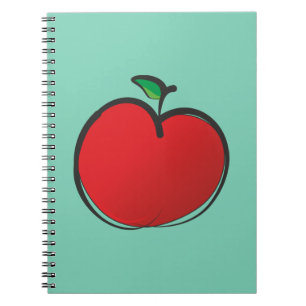 Cuaderno Gran Apple roja dibujando sobre un fondo verde pál