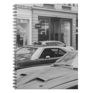 CUADERNO GREYSCALE PHOTOGRAPHY OF CARS ON ROAD BESIDE BUILD