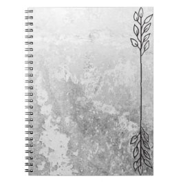 Cuaderno gris con acento en el borde